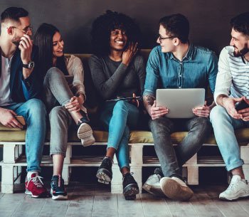 Diverse friends sharing a laptop