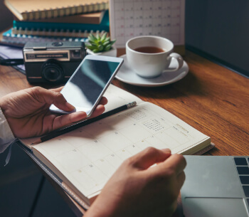 person marking their calendar