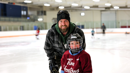 Father and son at public skate.