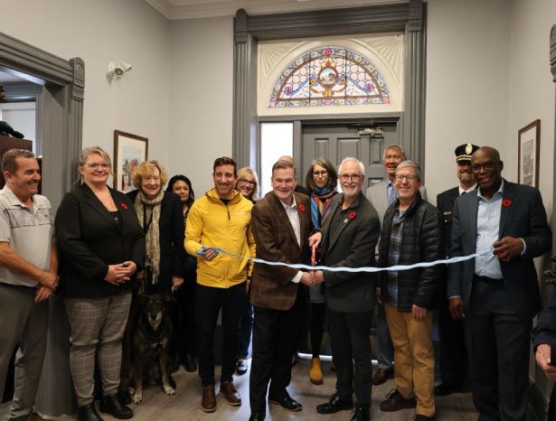 Members of Council. Clarington staff, and the Clarington Heritage Committee cut a ribbon to open the newly renovated Shaw House