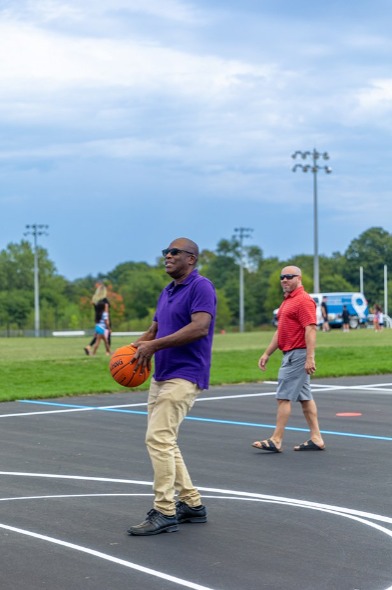 Regional Councillor for Wards 1 and 2, Granville Anderson, shoots some hoops on the new multi-skills court at South Courtice Arena. 