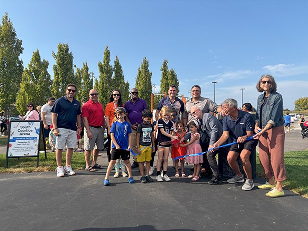 Mayor Foster, Members of Council, Clarington Staff and residents cut the blue ribbon to officially launch the new amenitites at South Courtice Arena