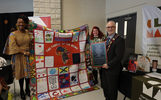 Nadine Williams holds community-led quilting project with Donnalee Smith of the Clarington Library, Museums and Archives, alongside Clarington Mayor Adrian Foster.