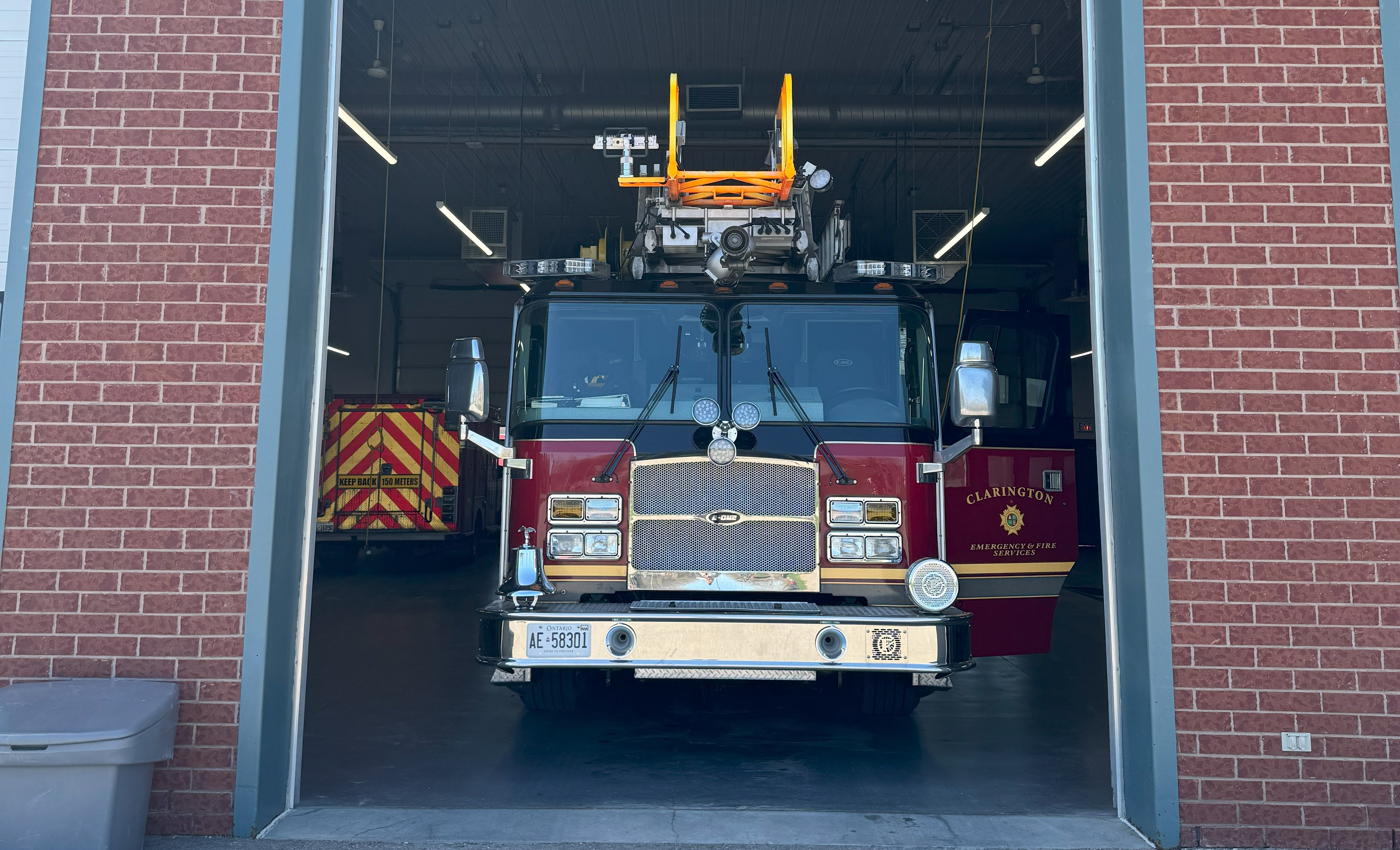 A Clarington fire truck in the bay of a fire station.