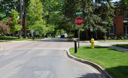 A roadway with a curb protruding from the right side.