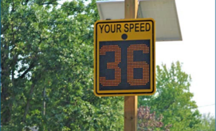 Radar message board with digital screen showing kilometre speed.