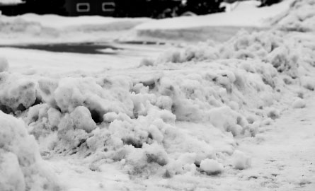 Image of the windrow of a driveway full of snow.